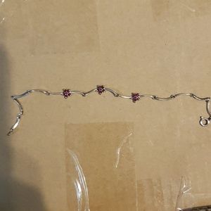 Sterling silver bracelet with 3 ruby flowers